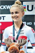  ??  ?? Best of British: Megan Barker wears her silver medal with pride