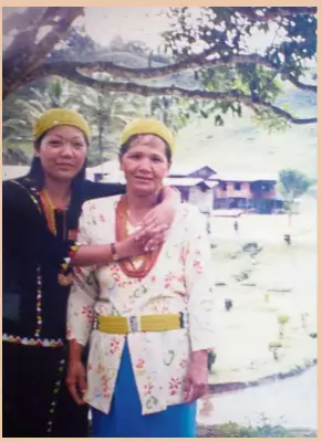  ??  ?? Agnes with Kam Agong (right) in front of their home in Long Semadoh. Photos: Agnes Padan