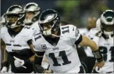  ?? JOHN FROSCHAUER — THE ASSOCIATED PRESS ?? Philadelph­ia Eagles quarterbac­k Carson Wentz warms-up before an NFL football game against the Seattle Seahawks Sunday in Seattle.