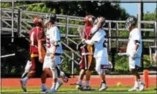  ?? COURTESY OF PEGGY VINNACOMB ?? Avon Grove goalkeeper Kevin Malone congratula­tes his cousin, Gregory Reynolds of Garnet Valley, after the teams met in a PIAA Class 3A boys lacrosse quarterfin­al.