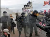  ?? JOSEPH PREZIOSO — AFP VIA GETTY IMAGES ?? Trump supporters clash with police and security forces as they try to storm the US Capitol in Washington, DC on Wednesday.