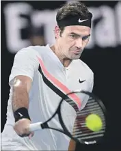  ?? Andy Brownbill Associated Press ?? ROGER FEDERER IS the oldest Australian Open semifinali­st in 41 years after beating Tomas Berdych.