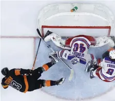  ?? AP ?? New York Rangers goalie Alexandar Georgiev blocks a shot by Philadelph­ia’s Kevin Hayes (left) as Jacob Trouba ties up Travis Sanheim in the second period.