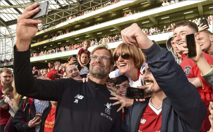  ?? Photo: Matt Browne/Sportsfile ?? Liverpool manager Jurgen Klopp with supporters after the game against Athletic Bilbao at the Internatio­nal Club tournament in the Aviva Stadium in Dublin last summer.