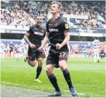  ??  ?? Callum Connelly celebrates scoring in Bolton’s 2-1 win at QPR on Saturday