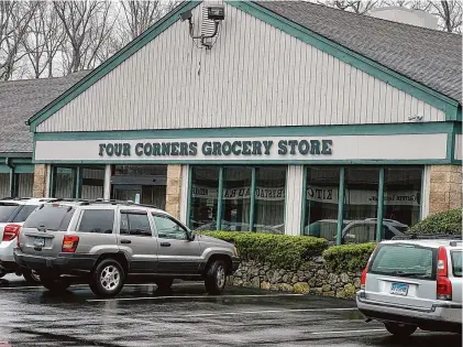  ?? Luther Turmelle/Hearst Connecticu­t Media ?? The exterior of the Four Corners Grocery Store in Middlebury as seen on Friday. The store is closing at the end of the month after 83 years in business and will reopen as a next generation version of the discount retailer Dollar General.