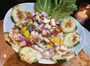  ??  ?? The Tex-Mex and interior Mexican food menu at Las Guitarras Cocina Mexicana includes whitefish ceviche with jicama and mango.