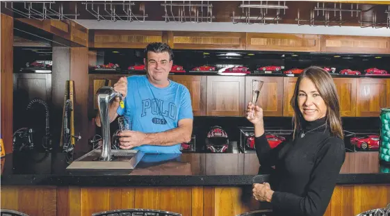  ?? Picture: JERAD WILLIAMS ?? Former cricketer and race driver Scott Hookey, and wife Lisa, are selling their Sanctuary Cove mansion to downsize by the sea.