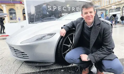  ??  ?? Stunt driver Mark Higgins with a James Bond Aston Martin DB10. Inset, Daniel Craig as James Bond