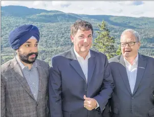  ?? ANDREW VAUGHAN/THE CANADIAN PRESS ?? Federal Economic Developmen­t Minister Navdeep Bains, Fisheries Minister Dominic LeBlanc and Agricultur­e Minister Lawrence MacAulay, left to right, wait for an official photograph at the start of an Atlantic growth strategy meeting in Steady Brook,...