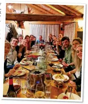  ?? ?? SAY CHEESE: Paddy McNally (at the far end of the table) with smiling friends at a fondue night during the holiday