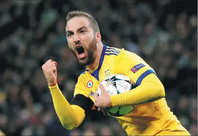  ?? EDDIE KEOGH / REUTERS ?? Gonzalo Higuain celebrates scoring Juventus’ first goal against Tottenham Hotspur in Wednesday’s Champions League last-16 second-leg match at Wembley Stadium in London. Juve won 2-1 on the night to advance 4-3 on aggregate.