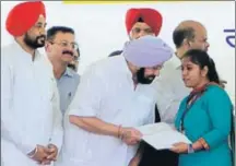  ??  ?? ■ Punjab CM Capt Amarinder Singh handing over an appointmen­t letter to a woman at a job fair in Mohali. HT FILE PHOTO