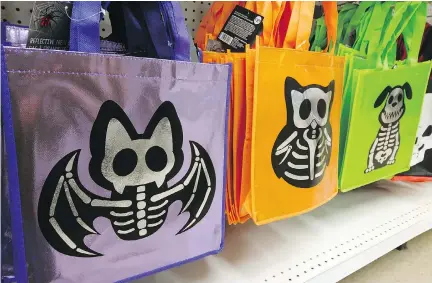  ??  ?? These reflective treat bags combine safety and style. Available for $3.50 each at Real Canadian Superstore and select Loblaw locations.