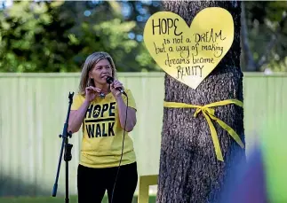  ?? PHOTO: MURRAY WILSON/FAIRFAX NZ ?? Hope Walk organiser Katina Hughes wears a photo of her brother Adam, who committed suicide in 2009, on a pendant around her neck.