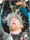  ?? COLIN E. BRALEY/AP ?? Tyler Reddick gets doused by his crew as he celebrates in Victory Lane after winning the NASCAR Cup Series race Sunday at Kansas Speedway.