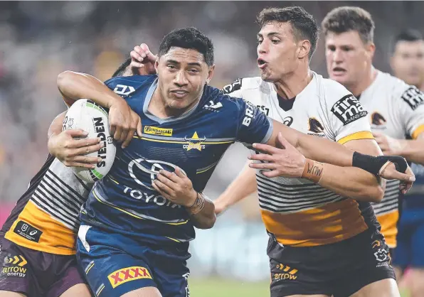  ??  ?? Jason Taumalolo of the Cowboys is tackled by Jordan Riki of the Broncos at Queensland Country Bank Stadium on Saturday. Picture: Getty Images