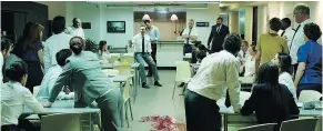  ?? — 20TH CENTURY FOX ?? In the new thriller The Belko Experiment, unsuspecti­ng American employees in a Colombian office building discover that getting killed on the job is the job.