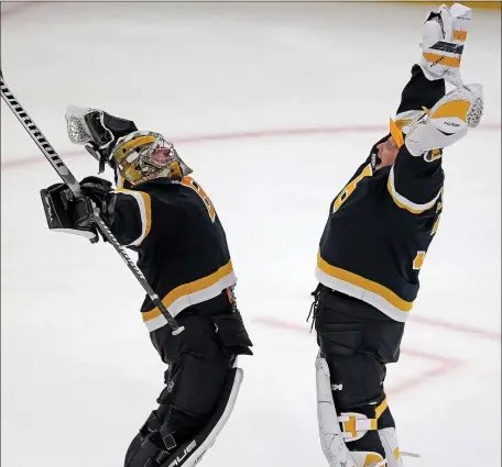  ?? MATT STONE — BOSTON HERALD ?? Bruins goaltender­s Jeremy Swayman, left, and Linus Ullmark celebrate after a 5-1 win over the Detroit Red Wings on Oct. 27 in Boston.