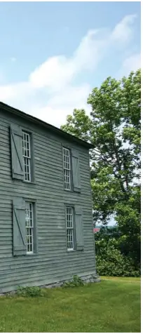  ??  ?? Old Hay Bay Church, left, is in Ontario’s historical township of Adolphusto­wn and is the oldest Methodist building in Canada. Built in 1792, it was the first meeting house for Loyalists in Ontario and is a National Historical Site. Rescued from use as a barn, the church today welcomes visitors interested in United Church history and the story of Ontario’s Loyalists. Its somewhat severe interior, top right, reflects its Methodist origins. The sounding board over the pulpit was used to amplify the preacher’s voice. Above, actors appear in Loyalist costume at the United Empire Loyalist landing site in Adolphusto­wn.