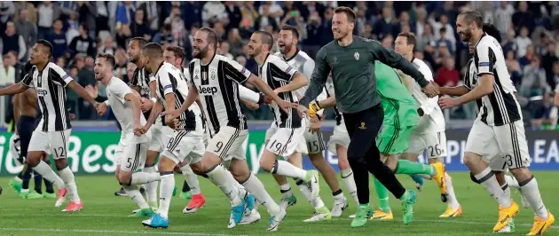  ??  ?? Juventus players celebrate their Champions League semi-final second leg win over Monaco in Turin, Italy, on Tuesday. Juventus won 2-1.