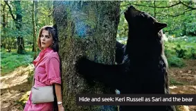  ?? ?? Hide and seek: Keri Russell as Sari and the bear