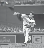  ?? DAVID KADLUBOWSK­I / AZCENTRALS­PORTS ?? Diamondbac­ks starting pitcher Zack Greinke throws against the Padres during the first inning of their game at Chase Field in Phoenix on Monday night.