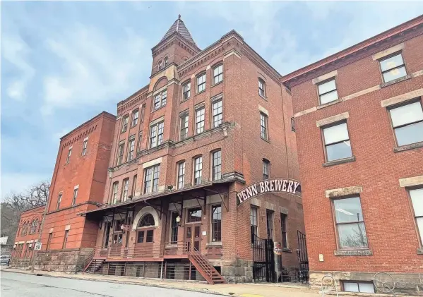  ?? STEVE STEPHENS PHOTOS/SPECIAL TO COLUMBUS DISPATCH ?? Penn Brewery, the city's first craft brewery, is located in buildings dating back to the mid-19th century.