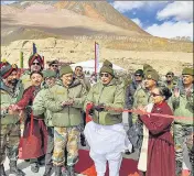  ?? PTI ?? Union defence minister Rajnath Singh inaugurate­s the ‘Colonel Chewang Rinchen Bridge’ at Shyok River in Ladakh on Monday.