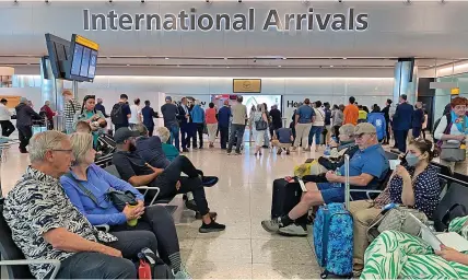  ?? KIN CHEUNG ?? Heathrow Airport yesterday as passengers flying into the UK faced delays due to problems with passport e-gates