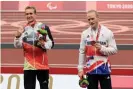  ??  ?? Johannes Floors and Jonnie Peacock shared the same step of the podium. Photograph: Carmen Mandato/Getty Images