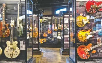  ?? STAFF PHOTO BY DOUG STRICKLAND ?? Songbirds Guitar Museum on Station Street houses an extensive collection of classic guitars.