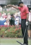  ?? Lynne Sladky/Associated Press ?? Tiger Woods takes a drop after hitting into the water on the 17th, the island hole.