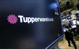  ?? RICHARD DREW — THE ASSOCIATED PRESS ?? The Tupperware Brands logo appears above a trading post on the floor of the New York Stock Exchange. Tupperware Brands on Wednesday posted third- quarter profit of $ 34.4 million, more than quadruple the $ 7.8 million from the same quarter a year ago.