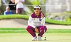  ?? Ahmed Ramzan/Gulf News ?? Down for the count Thidapa Suwannapur­a of Thailand lines up a putt during the final day of the Omega Dubai Ladies Masters yesterday.
