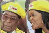  ?? PICTURE: PHILIMON BULAWAYO / REUTERS ?? CORNERED: Robert Mugabe with his wife Grace at a Zanu-PF rally in Harare last week.