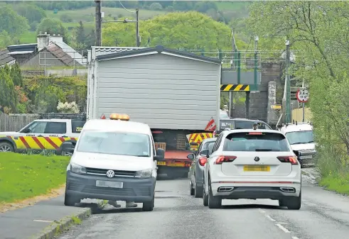  ?? ?? Turmoil
The scene at Rosehall Road in Shotts where nearby residents have been complainin­g about work going on without planning permission