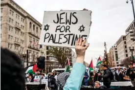  ?? Probal Rashid/LightRocke­t via Getty Images ?? People rally in support of Palestinia­ns in Washington DC on 2 December. Photograph: