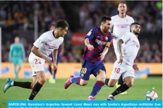  ?? — AFP ?? BARCELONA: Barcelona’s Argentine forward Lionel Messi vies with Sevilla’s Argentinia­n midfielder Ever Banega (R) during the Spanish league football match between FC Barcelona and Sevilla FC at the Camp Nou stadium in Barcelona.