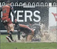  ??  ?? Castleford Tigers’s Luke Gale retrieves the ball during yesterday’s sodden home clash with Warrington Wolves.