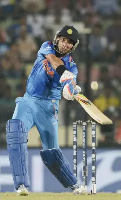  ??  ?? DHAKA: In this photograph taken on April 6, 2014, India’s Yuvraj Singh plays a shot during the ICC World Twenty20 cricket tournament final match between India and Sri Lanka in The Sher-e-Bangla National Cricket Stadium in Dhaka. India’s national...
