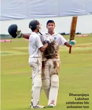  ??  ?? Dhananjaya Lakshan celebrates his unbeaten ton