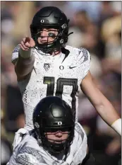  ?? DAVID ZALUBOWSKI — THE ASSOCIATED PRESS ?? Oregon quarterbac­k Bo Nix has 36 touchdowns this season — 22passing, 13rushing and one receiving.