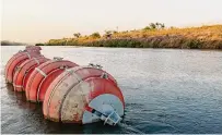  ?? Brandon Bell/Getty Images ?? The 5th Circuit Court of Appeals halted a ruling made by a lower court, allowing Texas to keep the migrant-blocking buoys for now pending further review.