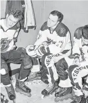  ??  ?? Yeshiva University roller hockey players wear yarmulkes under their helmets and strap padding over their white, tassled shawls, known as tallits.