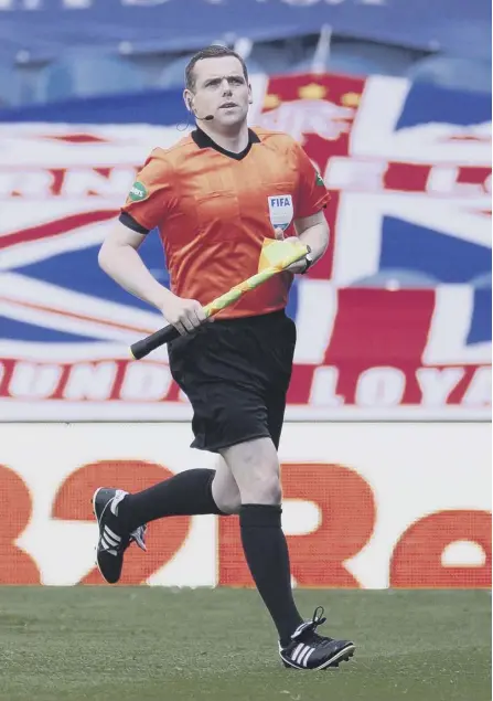  ??  ?? 2 Assistant referee and leader of the Scottish Conservati­ve Party Douglas Ross warms up prior to the Rangers vs St Mirren game earlier this month