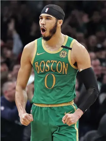  ?? MATT STONE / HERALD STAFF FILE ?? FEELING STRONG: Celtics forward Jayson Tatum screams out in celebratio­n during a game against the L.A. Clippers at the TD Garden on Feb. 13.