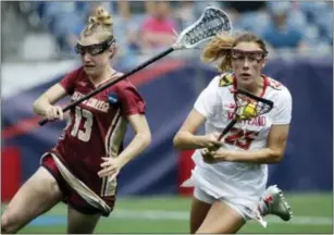  ?? ELISE AMENDOLA — THE ASSOCIATED PRESS ?? Maryland’s Lizzie Colson (25) controls the ball against Boston College’s Laura Frankenfie­ld (13) during the first half Sunday in Foxborough, Mass.