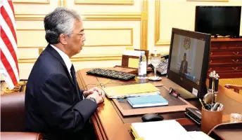  ?? — Bernama photo ?? Yang di-Pertuan Agong Al-Sultan Abdullah Ri’ayatuddin Al-Mustafa Billah Shah granted audience to the Prime Minister Tan Sri Muhyiddin Yassin during a Pre-Cabinet Meeting via video conferenci­ng at the National Palace yesterday morning.