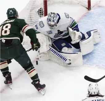  ?? ap ?? SHUTTING THE DOOR: Jacob Markstrom made 27 saves for his first postseason shutout as the Canucks pushed Minnesota to the brink with a 3-0 win in Game 3 yesterday.